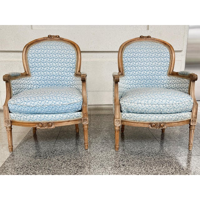 Pair of antique Louis XV bergère armchairs, originally handcrafted in the 19th Century from beech. They were later...