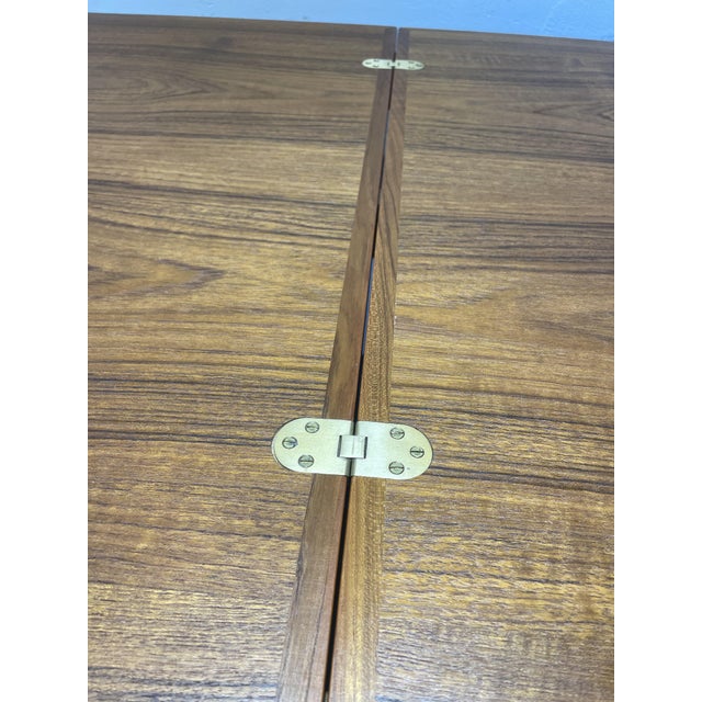 The tabletop can be folded out via two hinges and slid onto the base using a rail system, effectively doubling the...