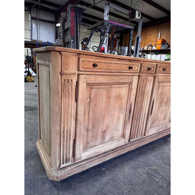 This is Early 20th century French server. Stripped of its original color giving it a driftwood tone. Two drawers with...