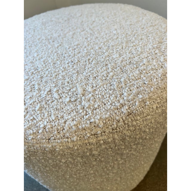 This pouf is beautifully tailored in a luxe multidimensional boucle. It can function as a footstool or side table. It is...