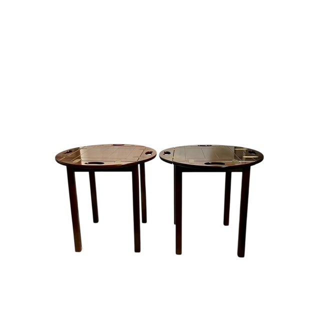 Pair of traditional style mahogany and brass butler’s tray tables. Tops are removable. These are a matched pair but one...