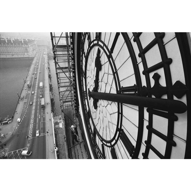 Face Of London The clock face of Big Ben in the Palace of Westminster, London, with Westminster Bridge over the River...