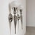 an elegant pair of 20th-century french wall lamps, crafted from nickel-plated aluminum and opal glass in a refined art...