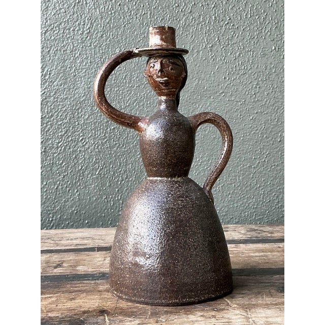 This unique Mid-Century Modern studio pottery candlestick celebrates the charm of soulful, artisanal hand-craftsmanship....