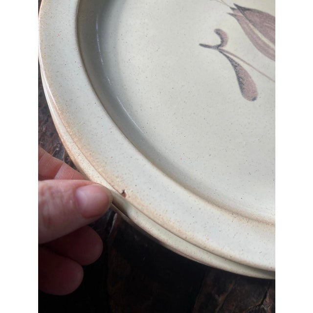 Lovely neutral and natural stoneware plates, this set of four dinner plates was made in Germany. Presented in a very pale,...