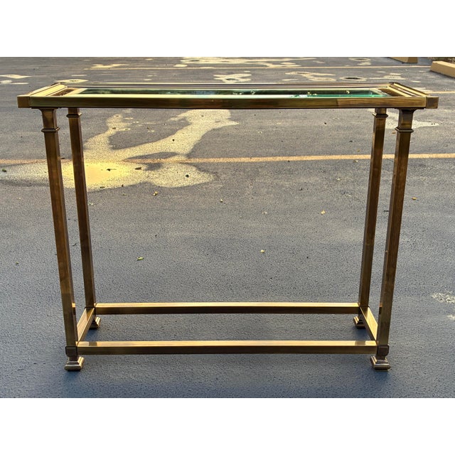 High quality aged brass picture frame console table with chamfered glass inset, manufactured in Italy for Mastercraft,...