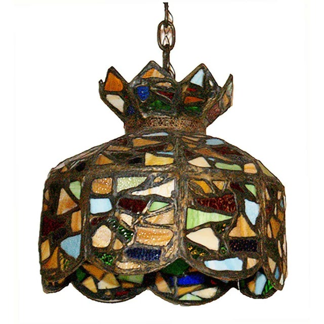 Early 20th century, multicolored Folk art chandelier having polychrome stained glass mosaic design shade.