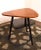 A small fine coffee table with triangular shape made by Hugo Troeds in Bjärnum, Sweden. The table is in very good...