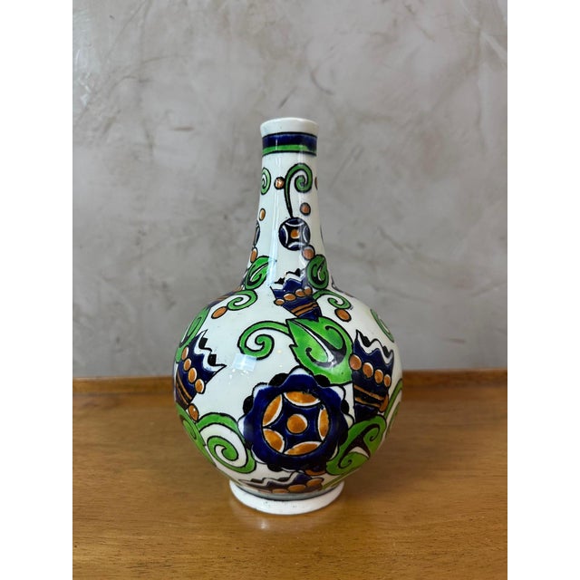 Very beautiful polychrome ceramic vase dating from the 1930s by Charles Catteau for Boch Keramis Freres. Tube-shaped...