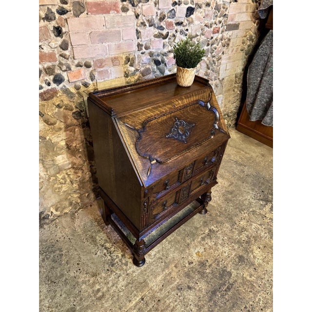 Fantastic example of a rare cantilever interior oak bureau. This amazing quality piece is crafted from solid oak...