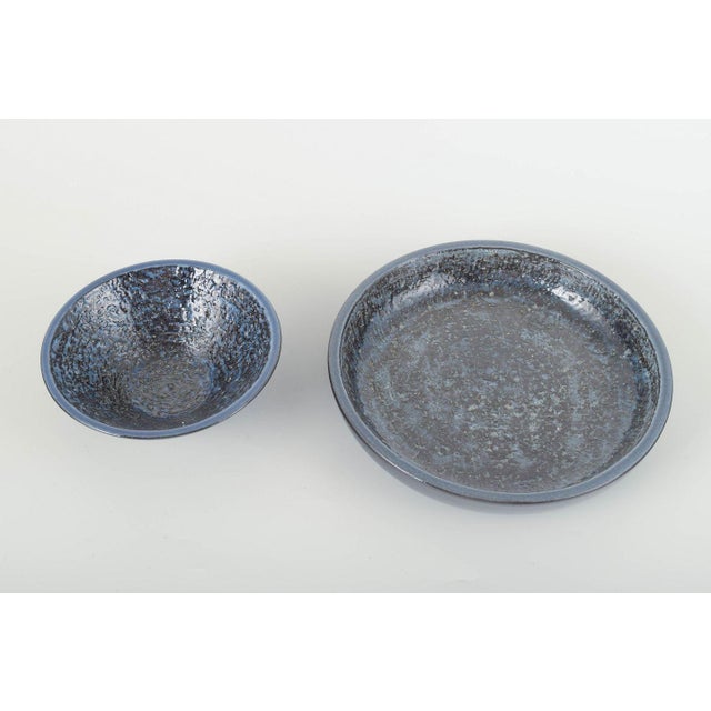 Ingrid Atterberg for Upsala-Ekeby Two bowls, models 2450 and 2452, 1960s. Two conical stoneware bowls with deep dark blue...