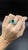Discover the allure of our exquisite cocktail ring, featuring a captivating 6.65 carat round emerald. This vibrant green...