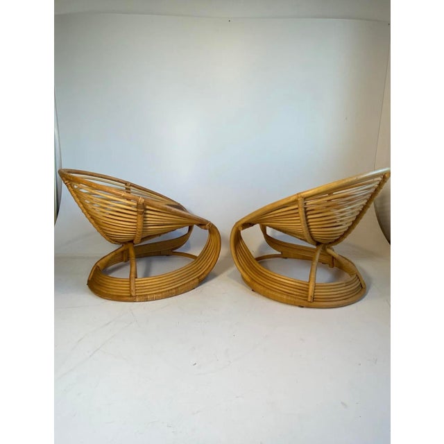 Two beautiful twisted, curved bamboo rattan armchairs from the 1970s Original cushions included Excellent craftsmanship...