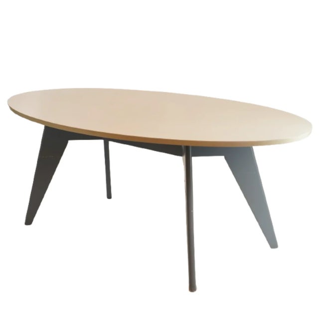 The Modern Oval Oak Dining Table combines sleek industrial elements with organic form, offering a striking yet versatile...