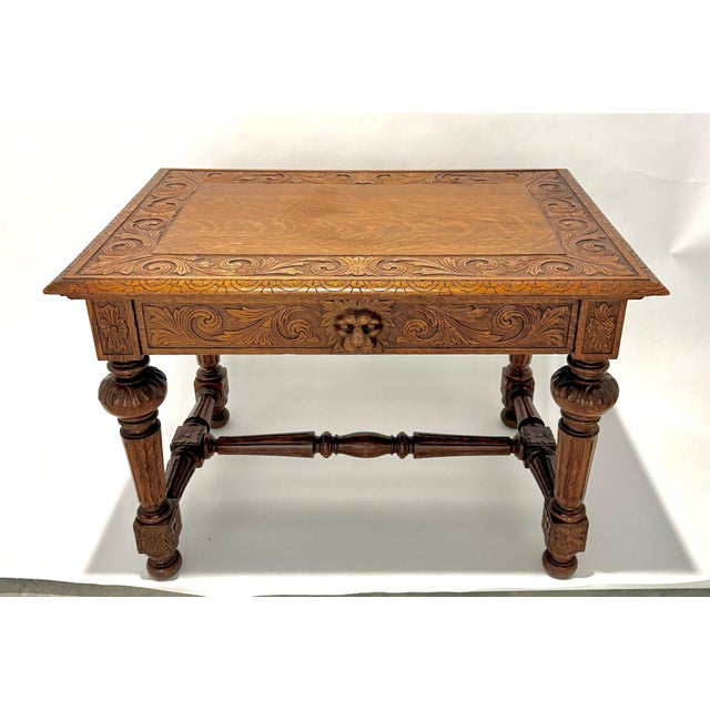 American renaissance carved oak desk/library table, in the manner of R.J. Horner, New York. Top with foliate carved...