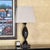 Vintage Mid-Century Modern-style sculptural table lamp featuring a distinctive twisted spiral base with a carved-wood...