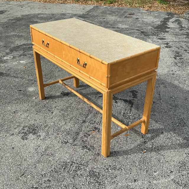 Bring timeless coastal charm to your home with this vintage Ficks Reed desk. Crafted from natural rattan and wicker, this...