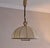 Cocoon pendant light, hand-crafted parchment with stitched leather binding on a brass frame, Italy 1950s. A rare lamp with...