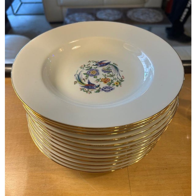 12 porcelain soup plates with gold-edged bird decoration edition Arnaud de Brissac for La Seynie. This piece has an...
