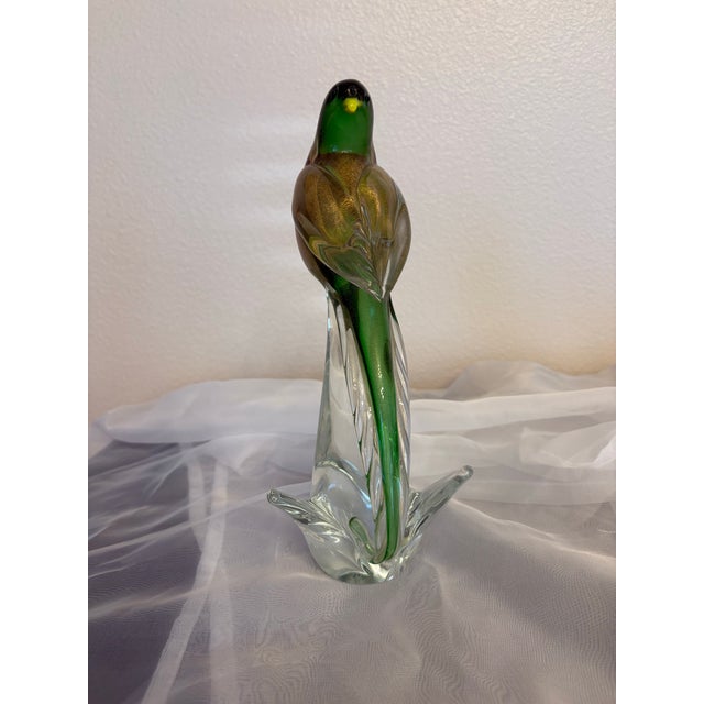 This green vintage Murano budgie sculpture is so fetching standing on the perch of the transparent base. It stands 10"...