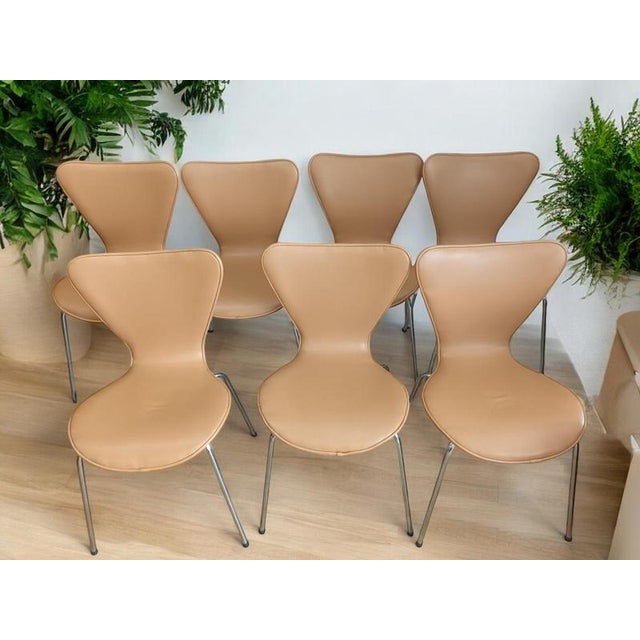 Enhance your interior with this exquisite set of seven danish-style stackable dining or reception chairs, designed for the...