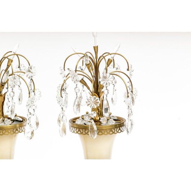 A stunning pair of luminaries embodying the timeless glamour of Hollywood Regency and French Empire design. Each piece...