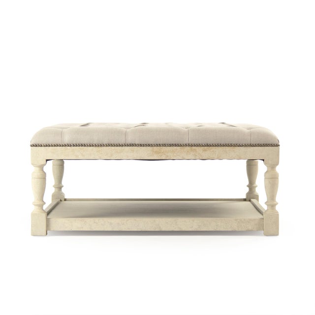 The Square Tufted Ottoman from Zentique is a versatile coffee table alternative with a button-tufted cushion top and a...