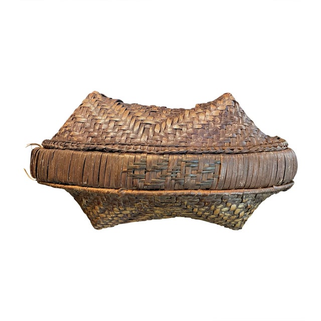 A set of handwoven basets. Two round and one oblong cornered basket with intricate tight weave. Used for the storage of...