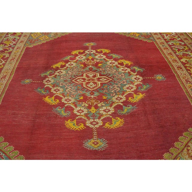 Art Deco Spellbinding Red-Raspebery Fiedl With Delicate Medallion Pattern Antique Turkish Ghiordes Oushak Rug For Sale - Image 3 of 12