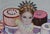 Let Them Eat Cake by Suzy Smith | Oil on Canvas Portrait of a woman with cakes in the background For Sale - Image 4 of 5