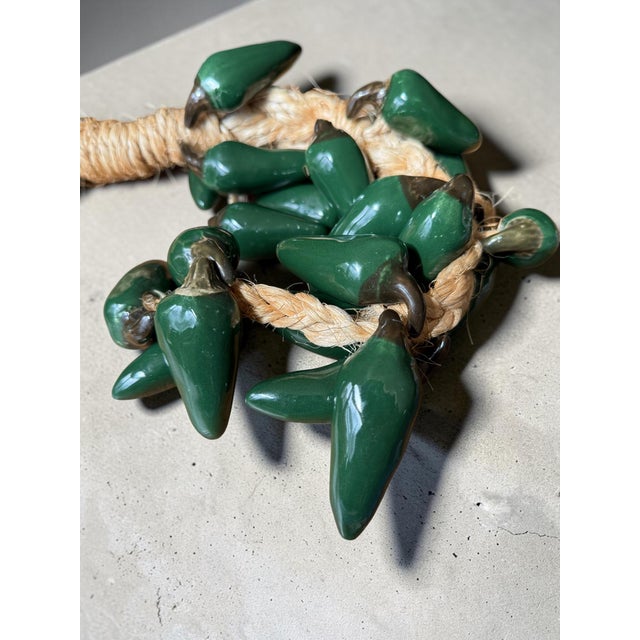 These are vintage handcrafted, glazed green chili pepper ceramic ristras used for rustic farmhouse or Southwest-style wall...