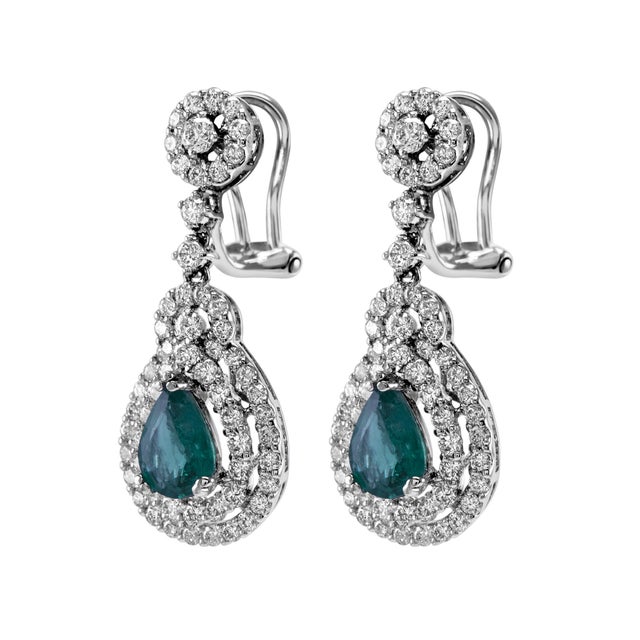 Beautiful natural oval emerald and diamonds drop earrings. 3.55 carats total gemstone weight. 2 pear emeralds, 1.50...
