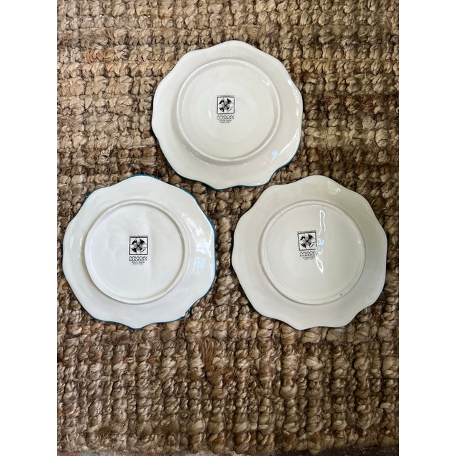 Colorful rooster plates by artist Cindy Shamp. The roosters are raised as well as the flowers in the border. Love the...