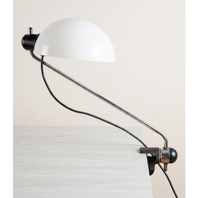 The Libellula clamp-on table lamp, produced in the 1970s by Guzzini and designed by Emilio Fabio Simion, is an icon of...