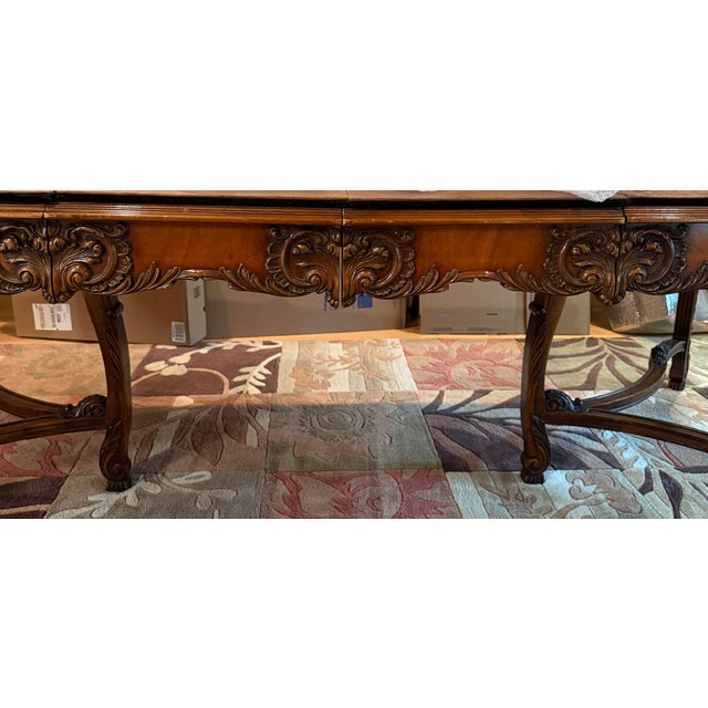 This exquisite Narra wood French Country dining set was made in 1943. The set includes the dining table, 2 arm chairs and...