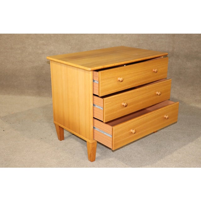 Vintage modern chest of drawers with finished back. Simple, almost rustic design with all wood drawers and knobs.