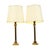 A pair of Hollywood Regency table lamps in the shape of a Corinthian column or pillar, classic lamps with round white...
