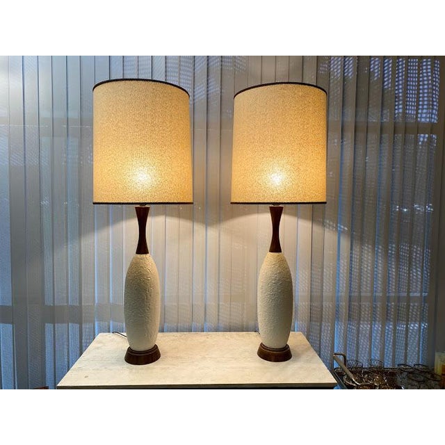 Fabulous Mid-Century Danish-Style table lamps. Ceramic molten center piece with what appears to be wood base and wood top....