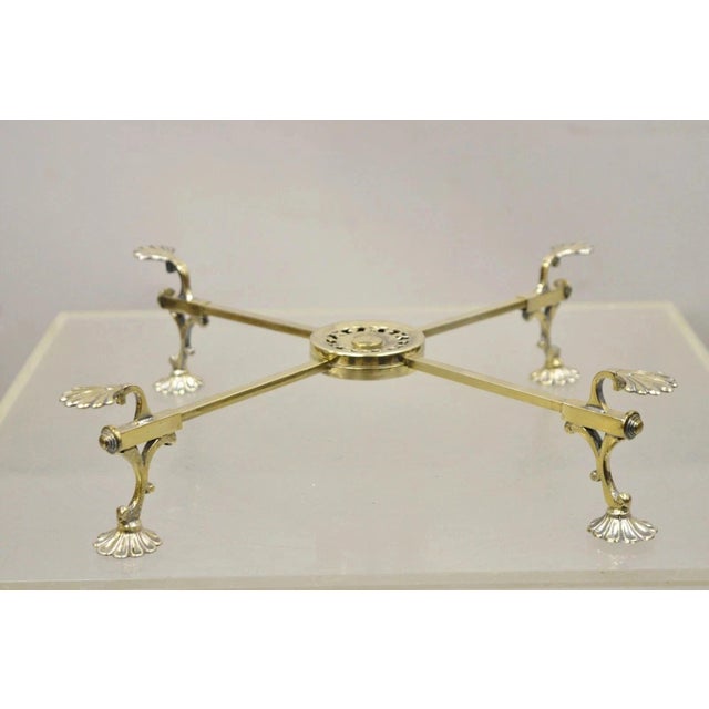 Vintage LFS Ltd English Sheffield Brass Tone Metal Expandable Footed Trivet. Item features a folding frame with adjustable...