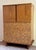 An oak dresser with basket weave motif. Designed by Paul Laszlo for Brown-Saltman of California. From the 1950’s.