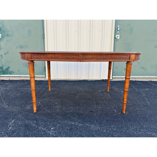 A rare find crafted by American of Martinsville in the 1970’s. Mid century modern and tropical in style, this dining table...