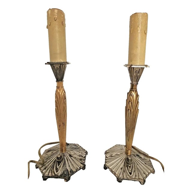 Elevate your space with this striking pair of original 1920s Art Deco candle lamps, featuring bold skyscraper-style design...