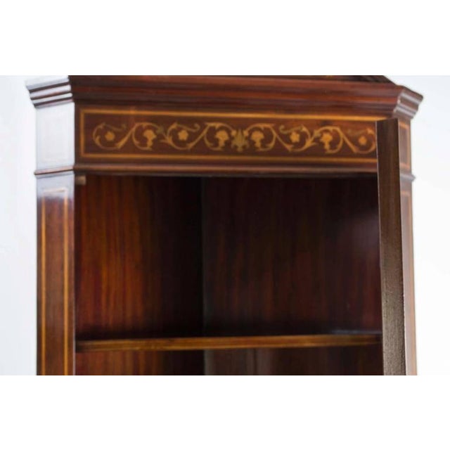 This is a fabulous antique English Edwardian profusely inlaid corner cabinet, circa 1880 in date. The cabinet is made of...