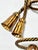 A sculptural pair of vintage Italian gilt-metal curtain tiebacks formed as twisted rope with dramatic tassel finials....