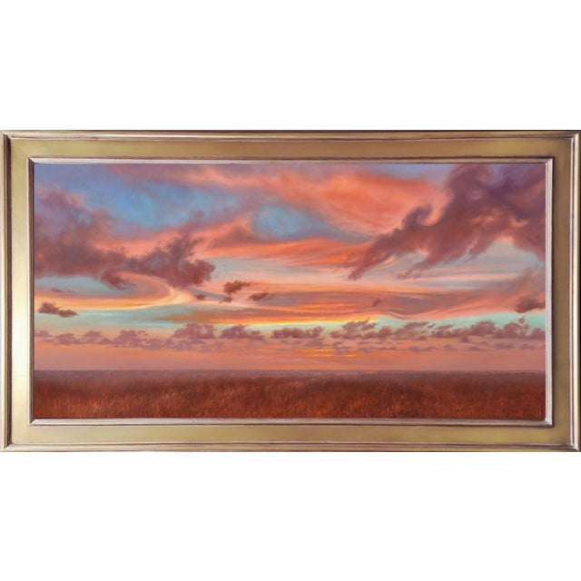 This artwork depicts a vast expanse of sky at dusk, where vibrant hues of orange, pink, and purple blend seamlessly with...