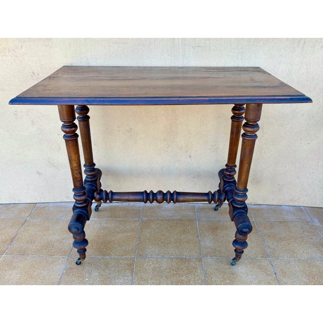 Elegant Victorian side table from the late 19th century, crafted in walnut with a beautiful naturally aged patina. The...