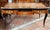 Antique French Napoleon III desk made of fine exotic wood with finely chased gilt-bronze accents. The top features an...