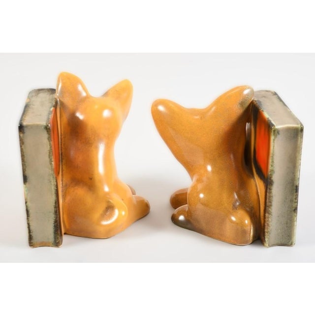 An exceptional pair of ceramic bookends from the Art Deco period, circa 1930, likely by Walter Bosse (Goebel/Keramos)....