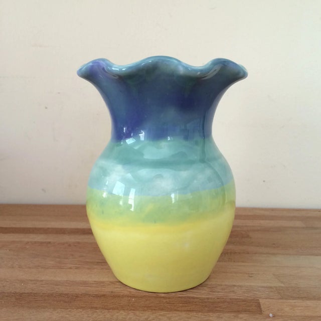 This 6" tall colorful vase is a beautifully created, and very colorful, piece of glazed pottery. The scalloped opening is...
