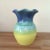 This 6" tall colorful vase is a beautifully created, and very colorful, piece of glazed pottery. The scalloped opening is...